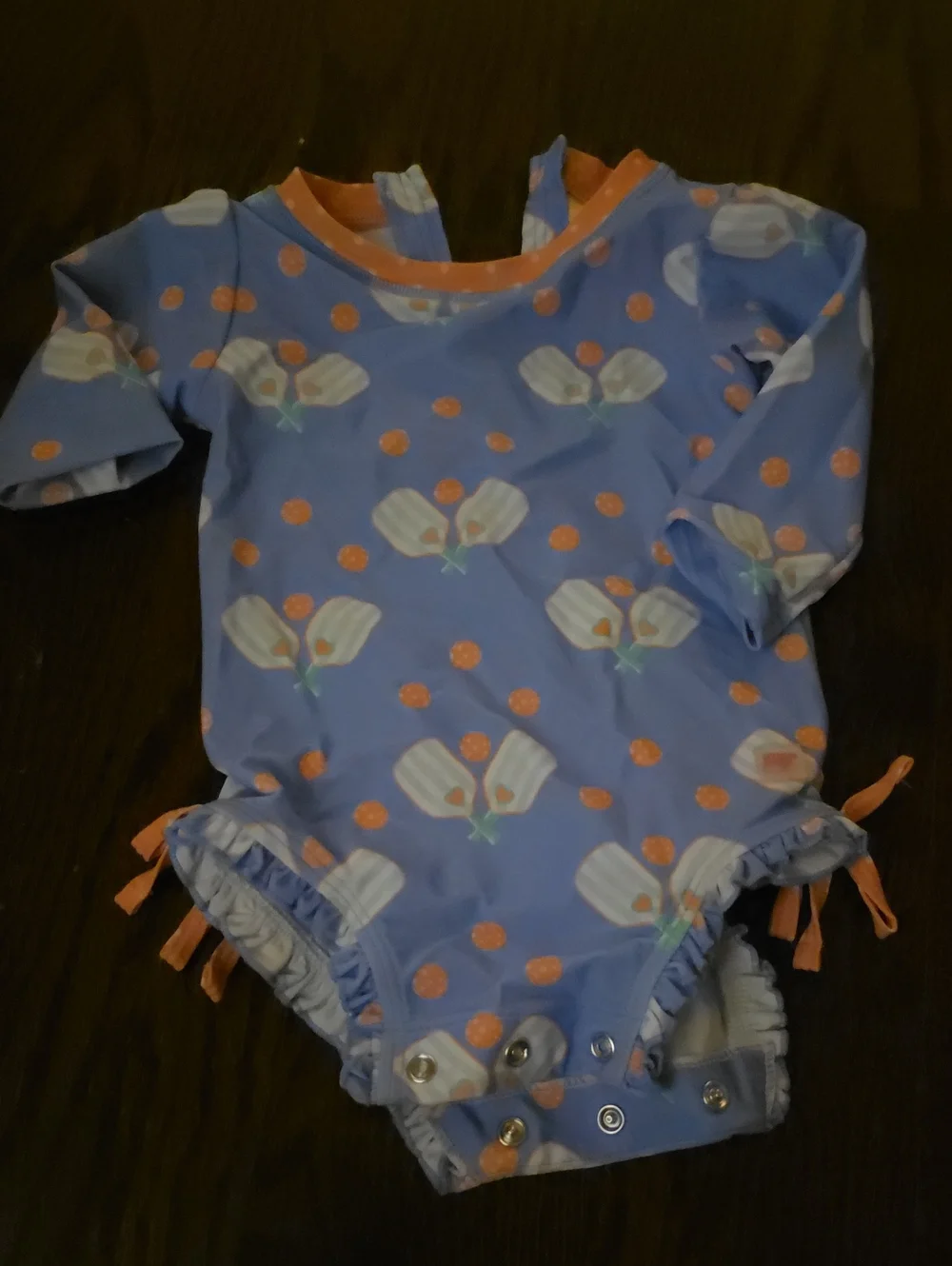 Ruffle Butts Blue Floral One-Piece Swimsuit with Orange Accents